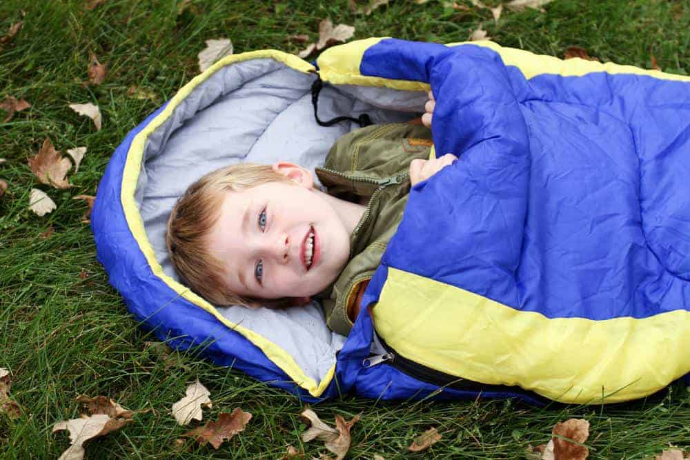 a kid in a sleeping bag